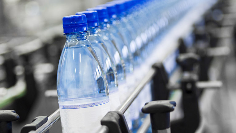 Conveyor with plastics bottles